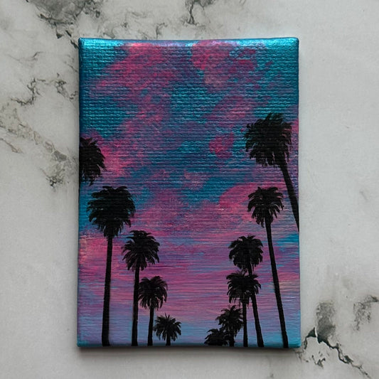 mini palm trees at sunset